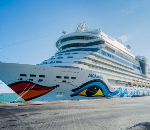 AIDA STELLA cruise ship with nationality of ITALY, length of 253.3 meters, width of 32.20 meters, and depth of 7.3 meters, docked safely at PAS
