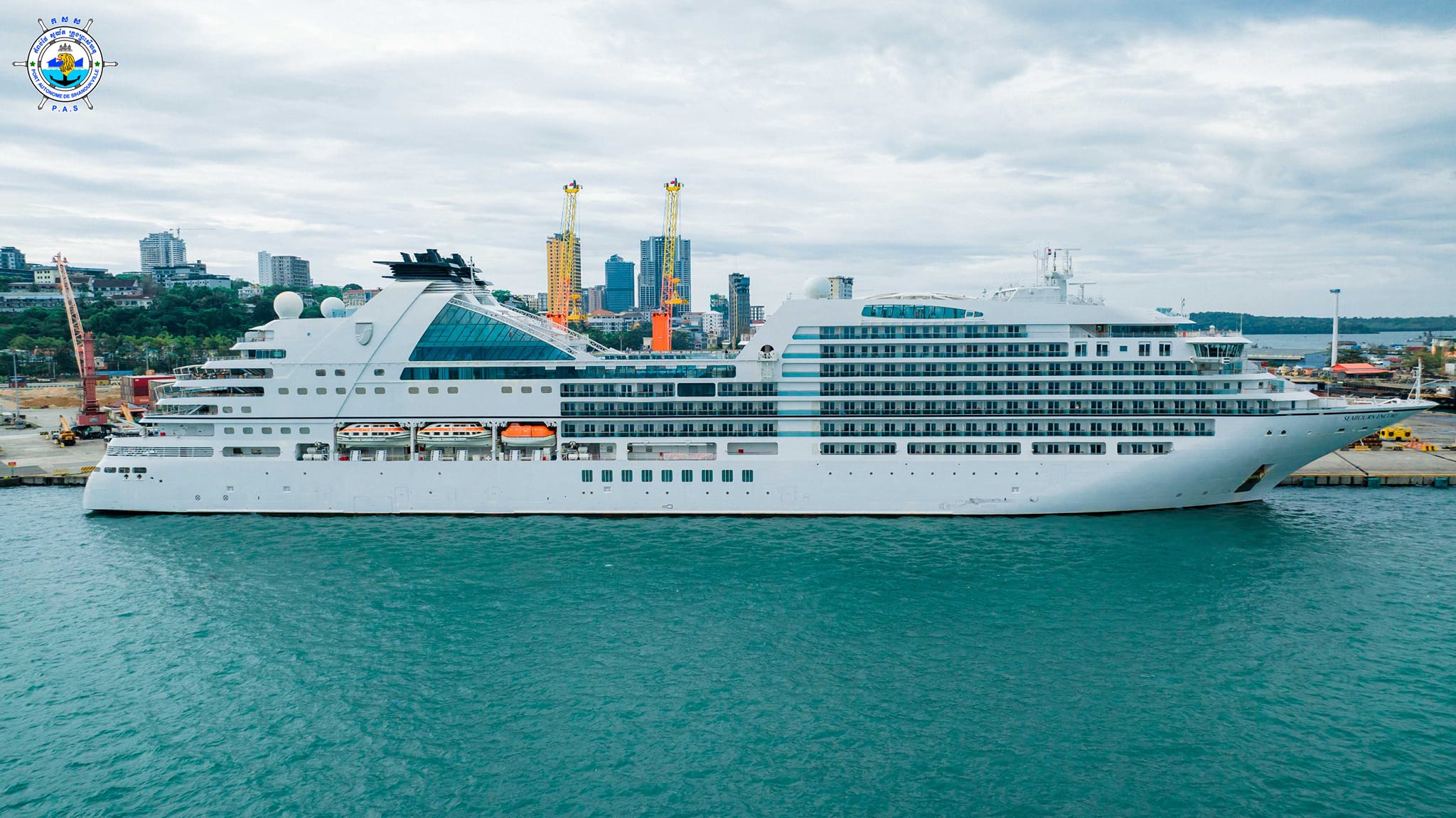 SEABOURN ENCORE cruise ship with nationality of BAHAMAS, length of 210.5 meters, width of 28 meters, and depth of 6 meters, docked safely at PAS
